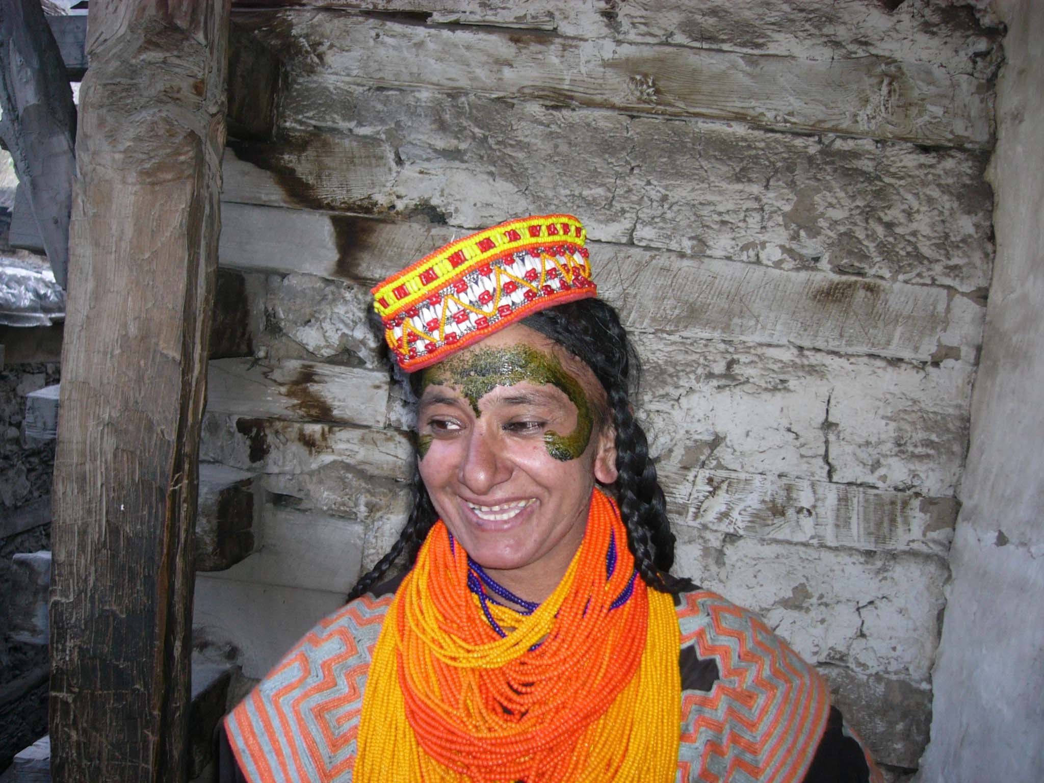 A kalash lady has pasted domestic medicines at her face