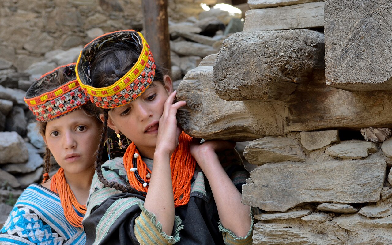 Kalasha Girls hiding outside.