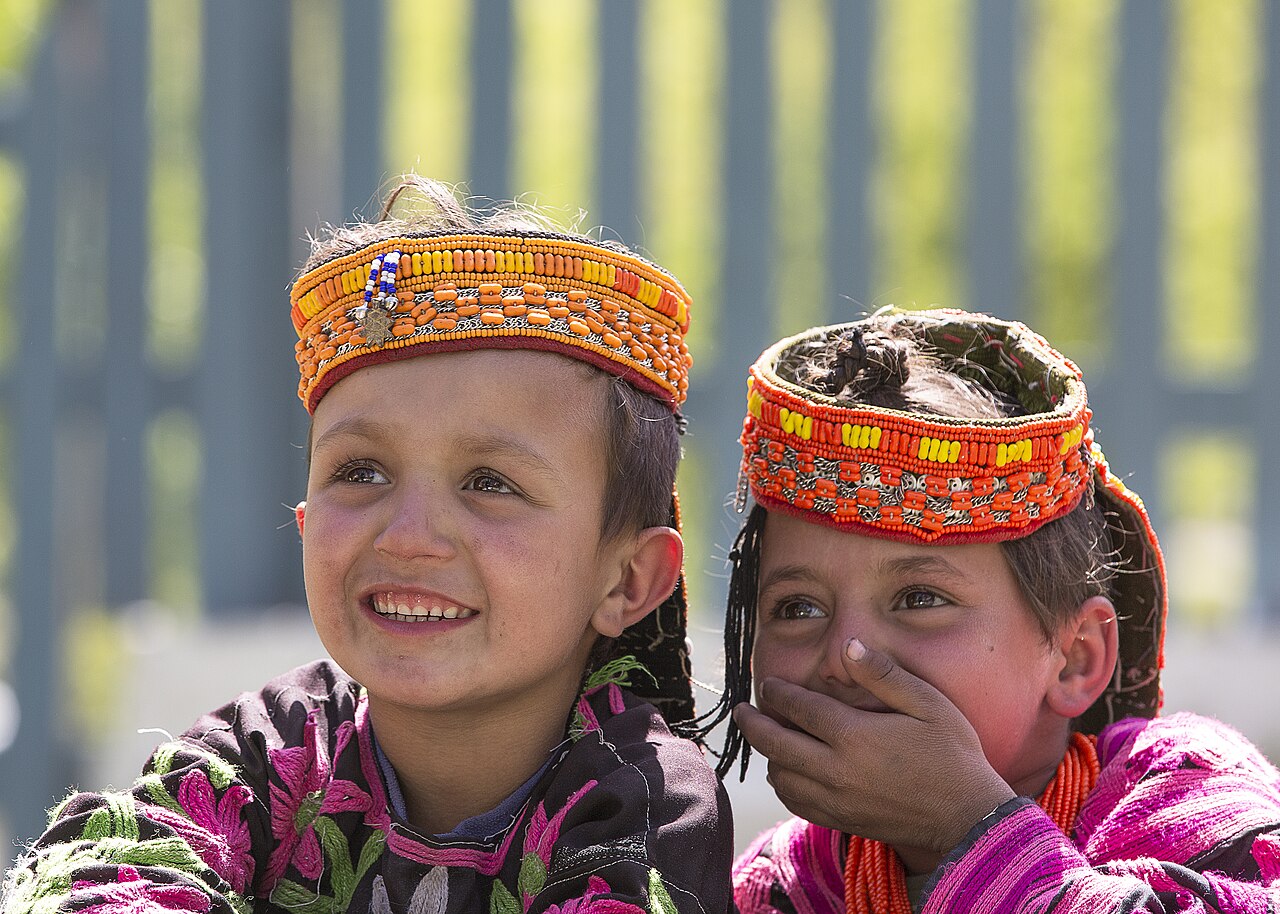 Two Little Kalash Girls Sharing Happiness