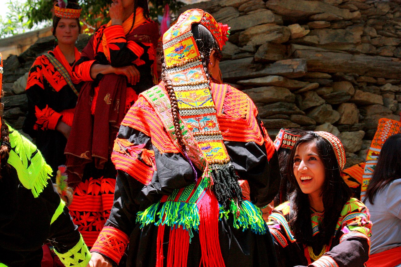 Traditional Kalash women's clothing including an elaborate headdress