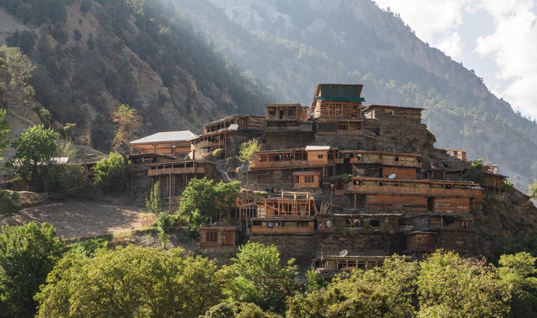 Wooden dwellings in Rumbur valley, one of the three valleys inhabited with Kalasha people