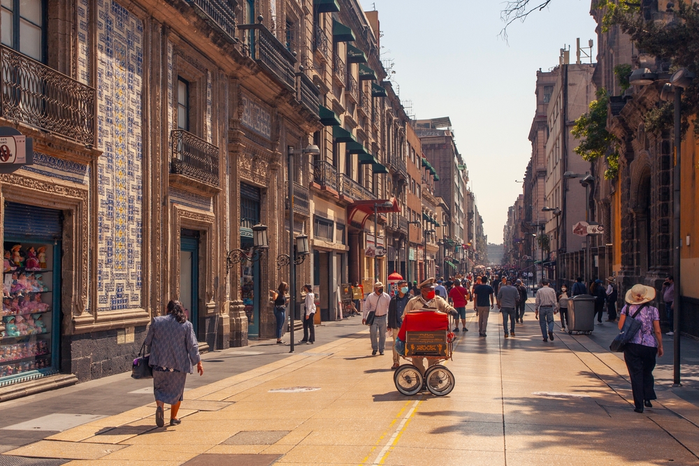 Locals and tourists, shops and restaurants on famous Madero Avenue