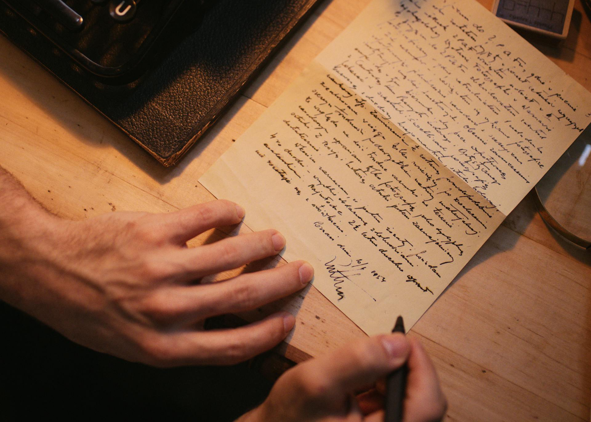 A Person Holding a Pen and a Piece of Paper