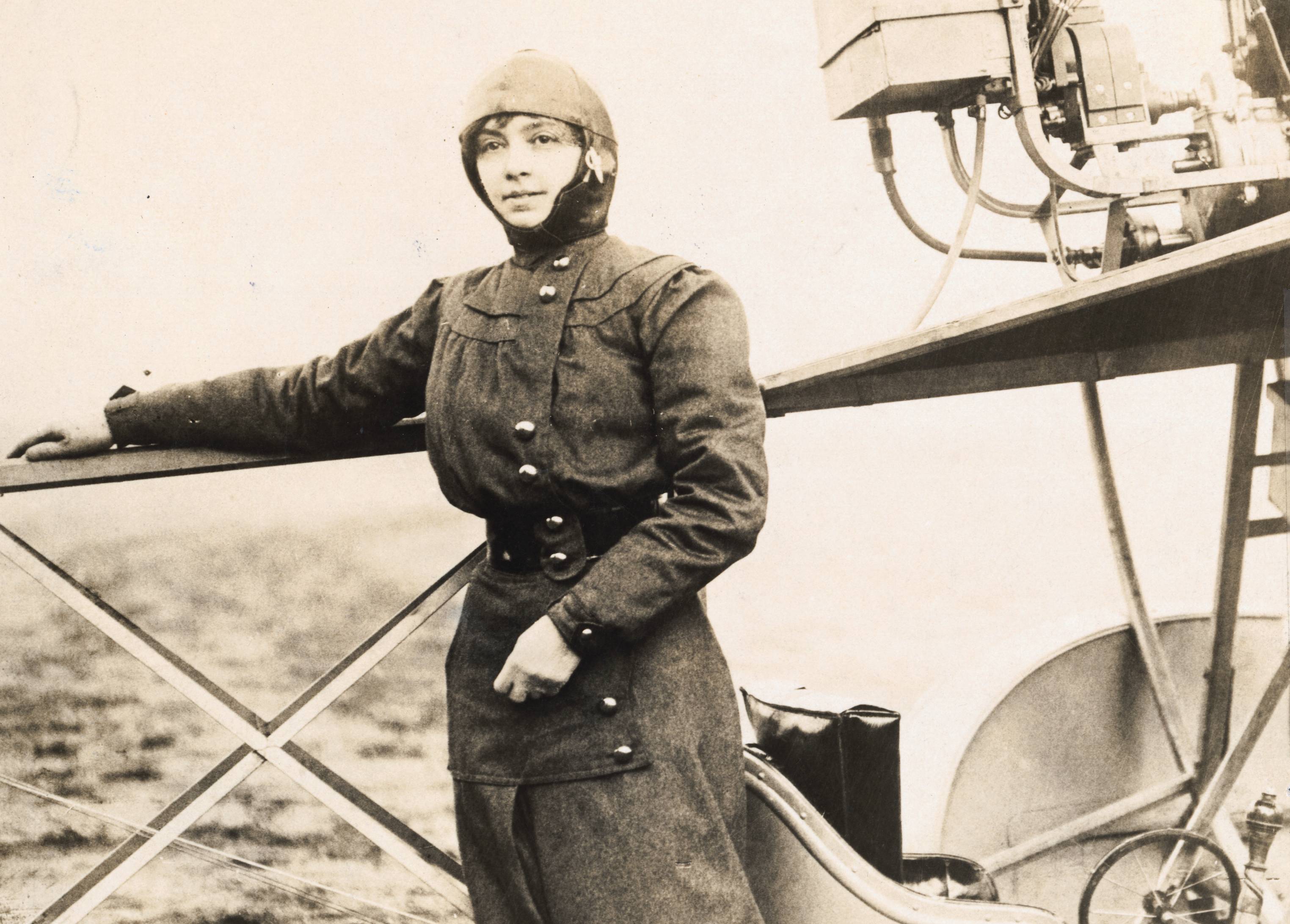 Aviatrix Marie Marvingt Posing by Airplane