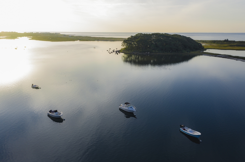A few boats sit in the Quonochontaug pond