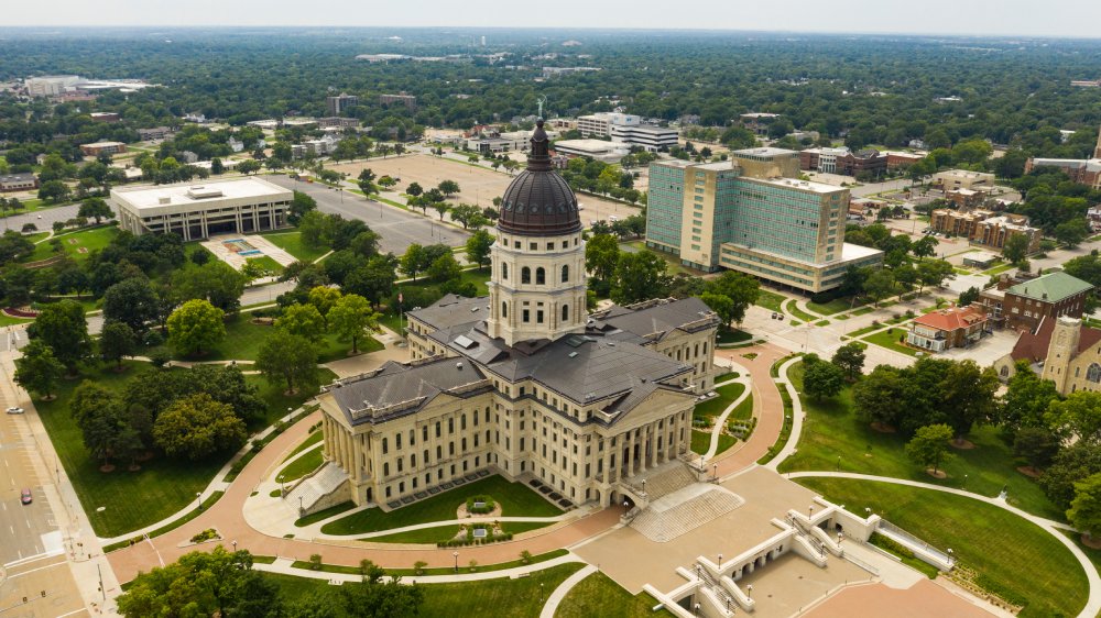 This image provides an aerial view of the Kansas State Capitol building in Topeka
