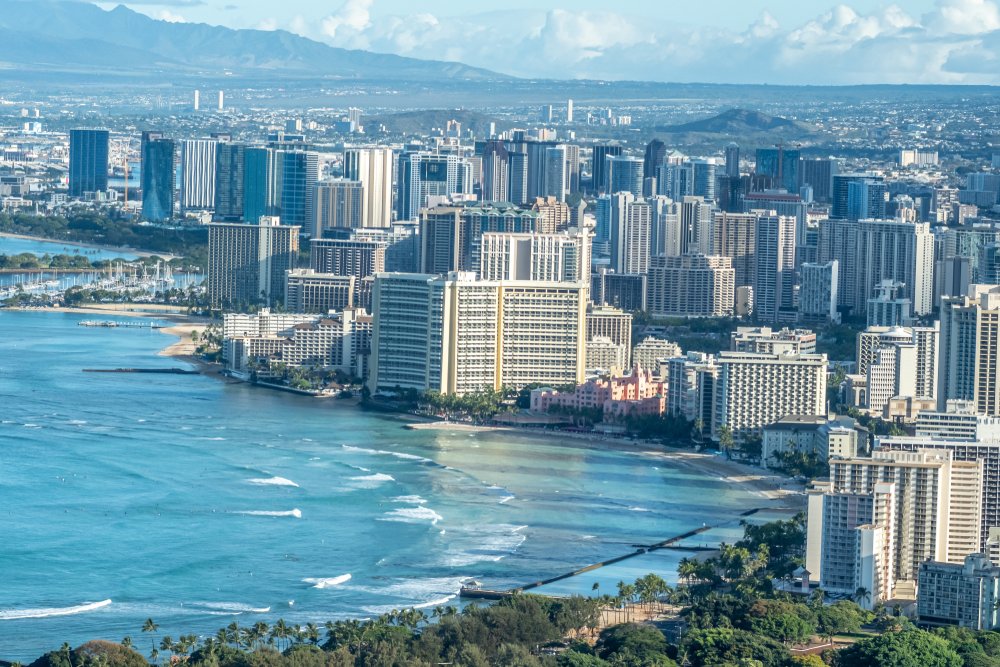 This image showcases a breathtaking panorama of Waikiki Beach in Honolulu, Hawaii