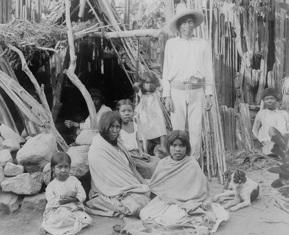 Yaquis Indians of Mexico by their hut, ca.1910