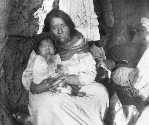 A Yaqui Indian mother and her three children, Arizona, ca.1910