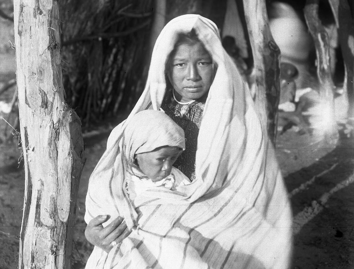 A Yaqui Indian mother holding a baby, Arizona, ca.1910