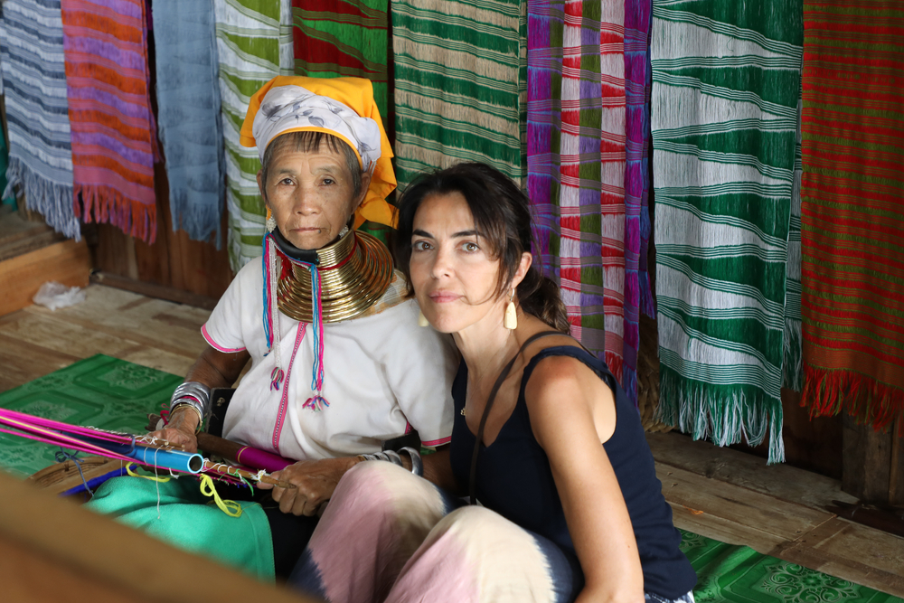 European lady with local Kayan tribe lady in silk store on Inle lake - 2019