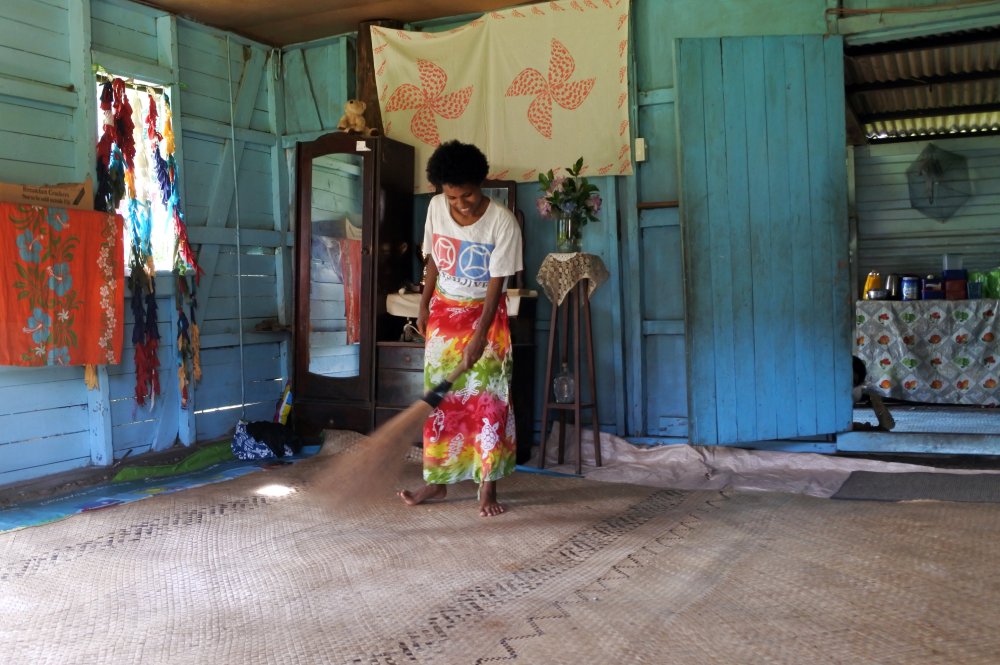 Portrait Photo of Indigenous Fijian woman cleans her home in Fiji