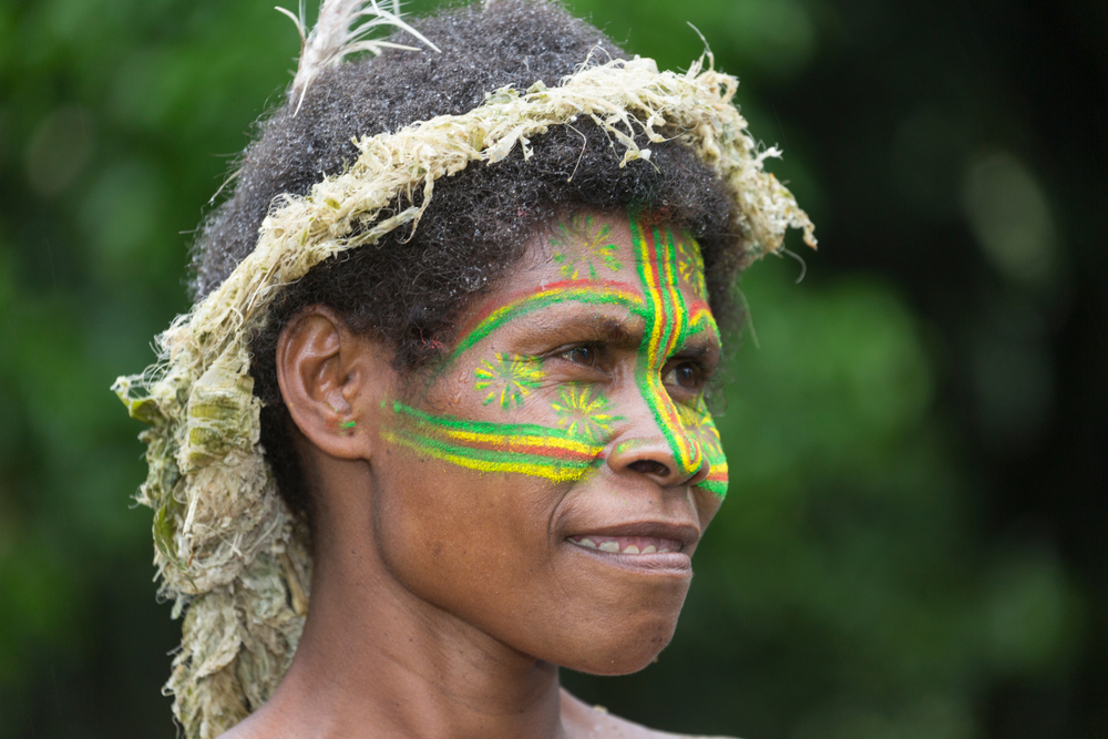 Portrait Photo of an indigenous Melanesia woman with traditional paint