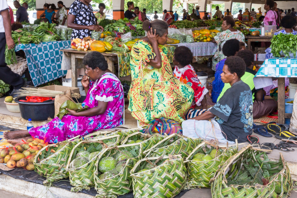 Vendors at fresh fruit and vegetable market in Port Vila, Vanuatu