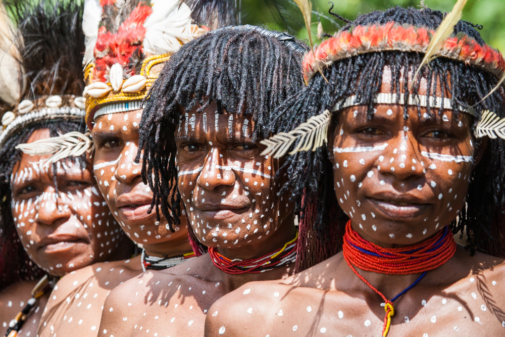 Portrait of Woman Dani tribe in ritual coloring on the body and face