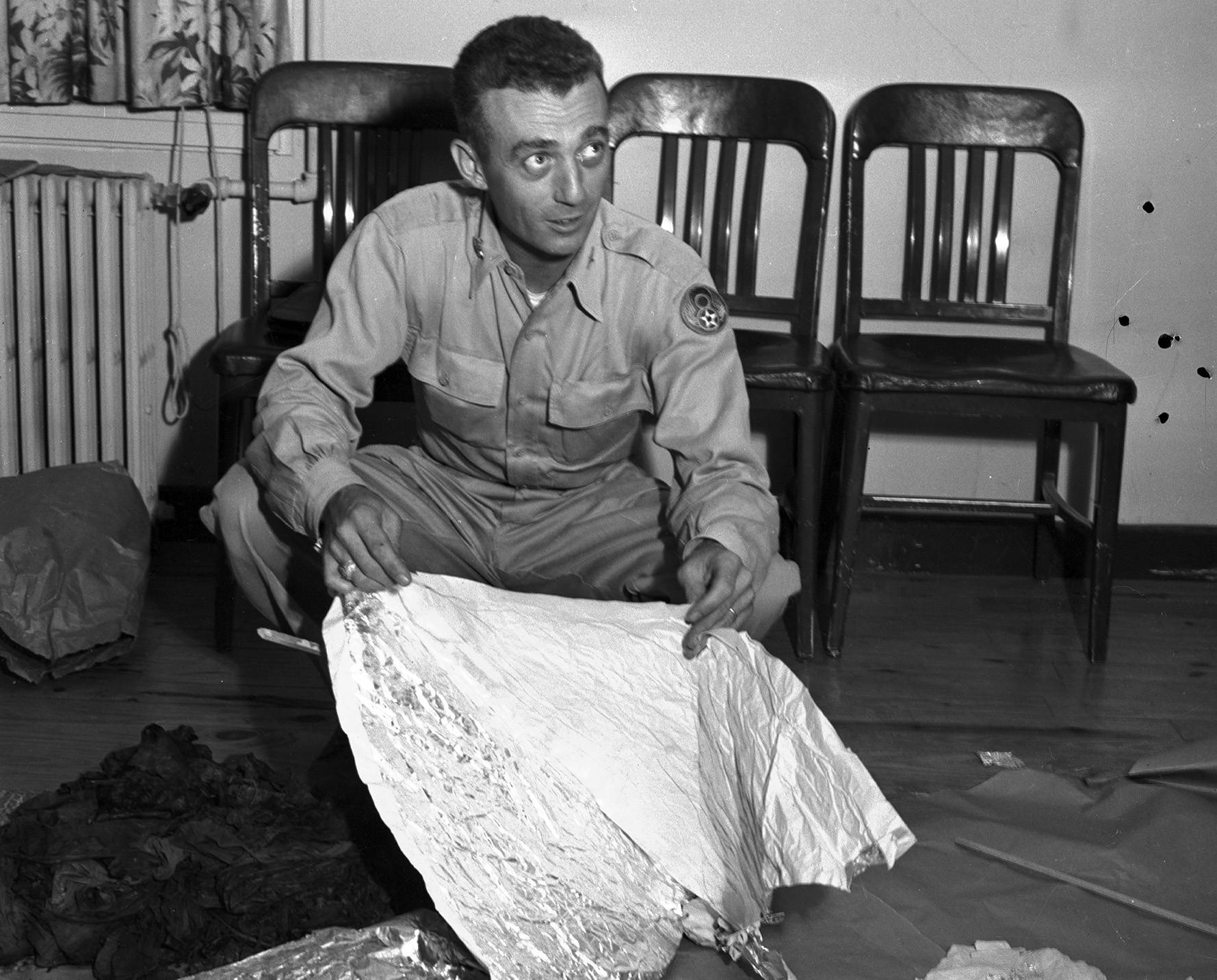 Major Jesse A. Marcel posing with weather balloon debris