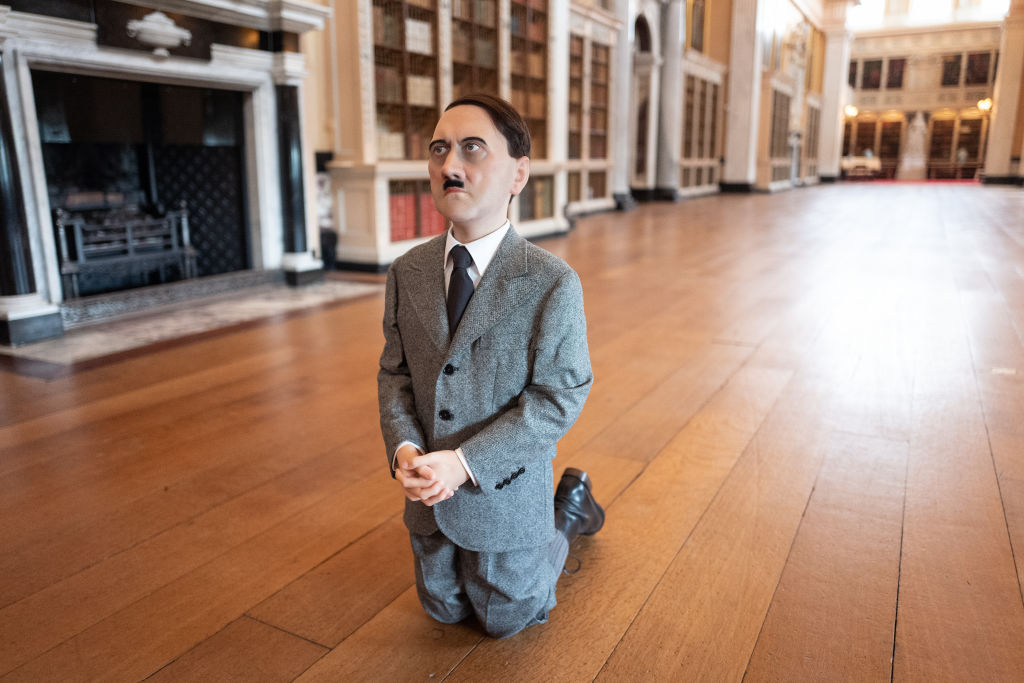 "Him", a realistic model of a kneeling schoolboy with the head of Adolf Hitler created by artist Maurizio Cattelan - 2019