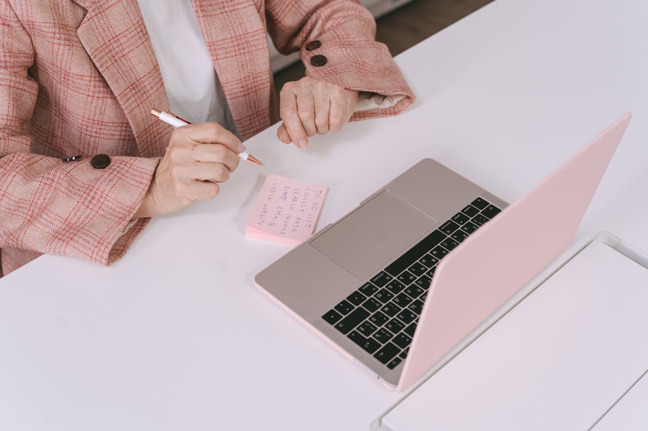 Person Sitting in Front of a MacBook