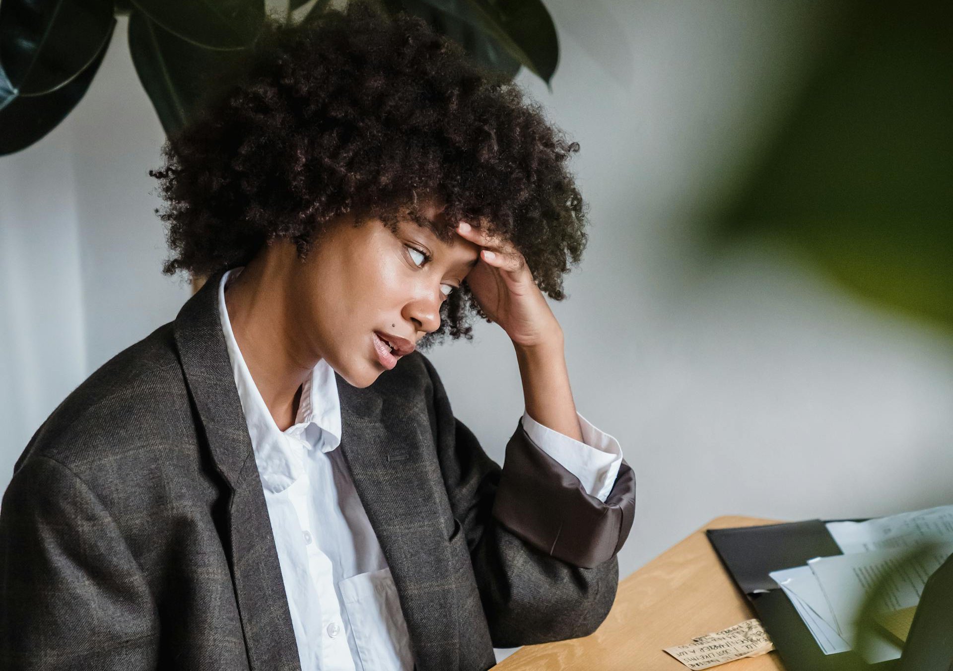 Woman Sitting Behind a Desk
