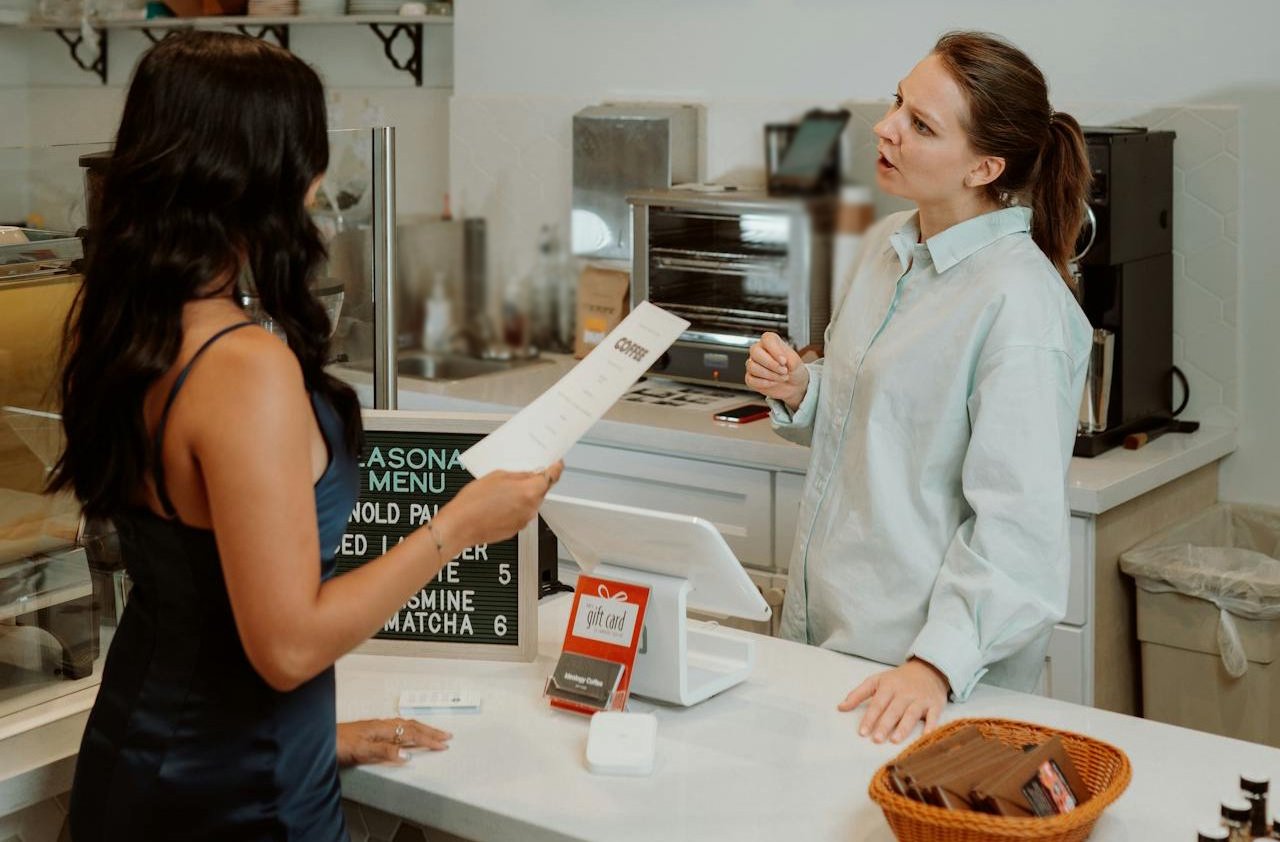 Barista Taking Orders from a Customer