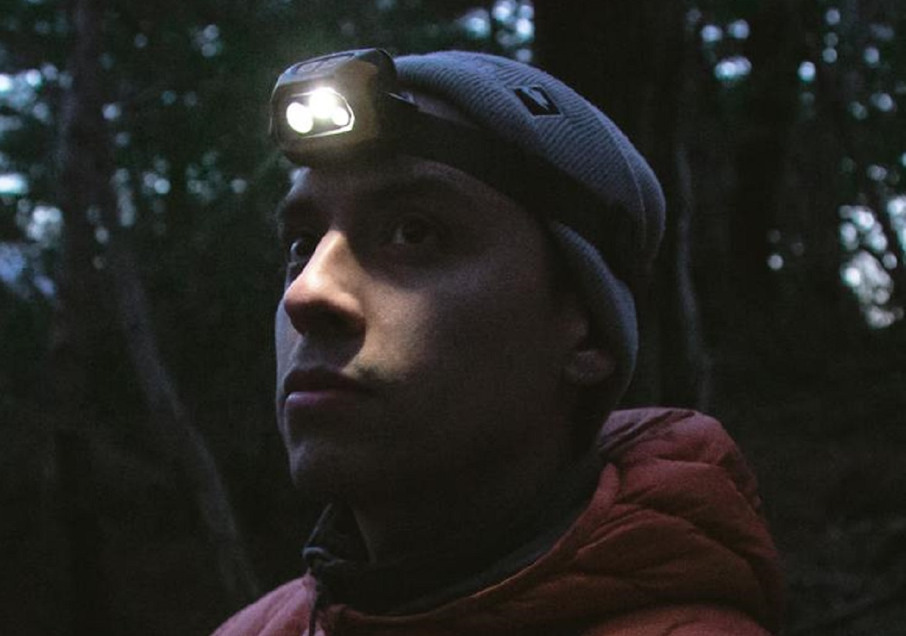 Man in a Winter Jacket and a Headlamp
