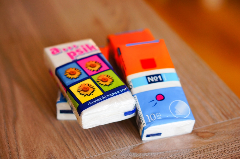 A set of soft white tissues packed in plastic on a table