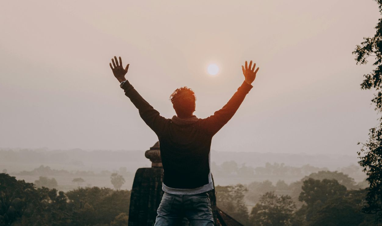 Man Raising His Arms