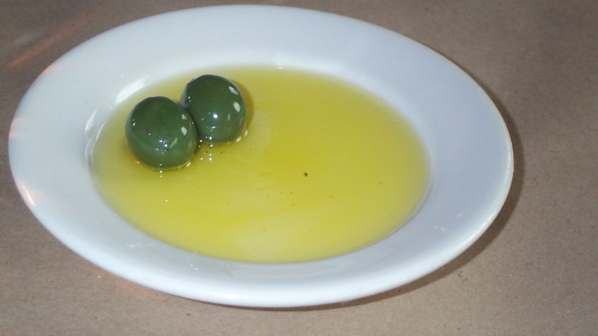 File:Olives in olive oil.jpg