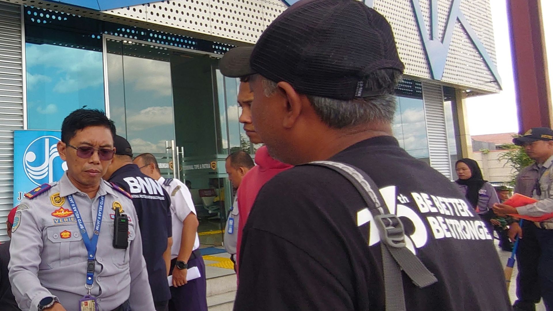 a group of people standing outside of a building