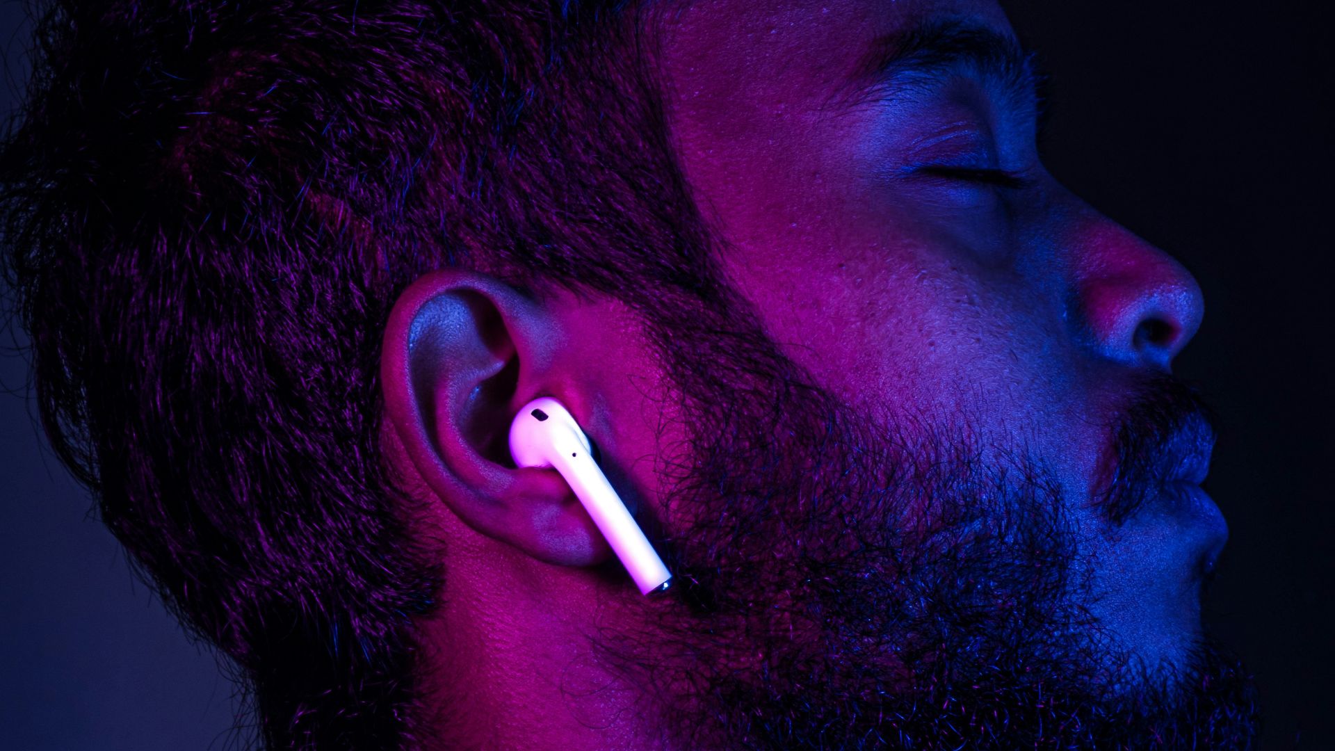 man in red shirt with cigarette in mouth