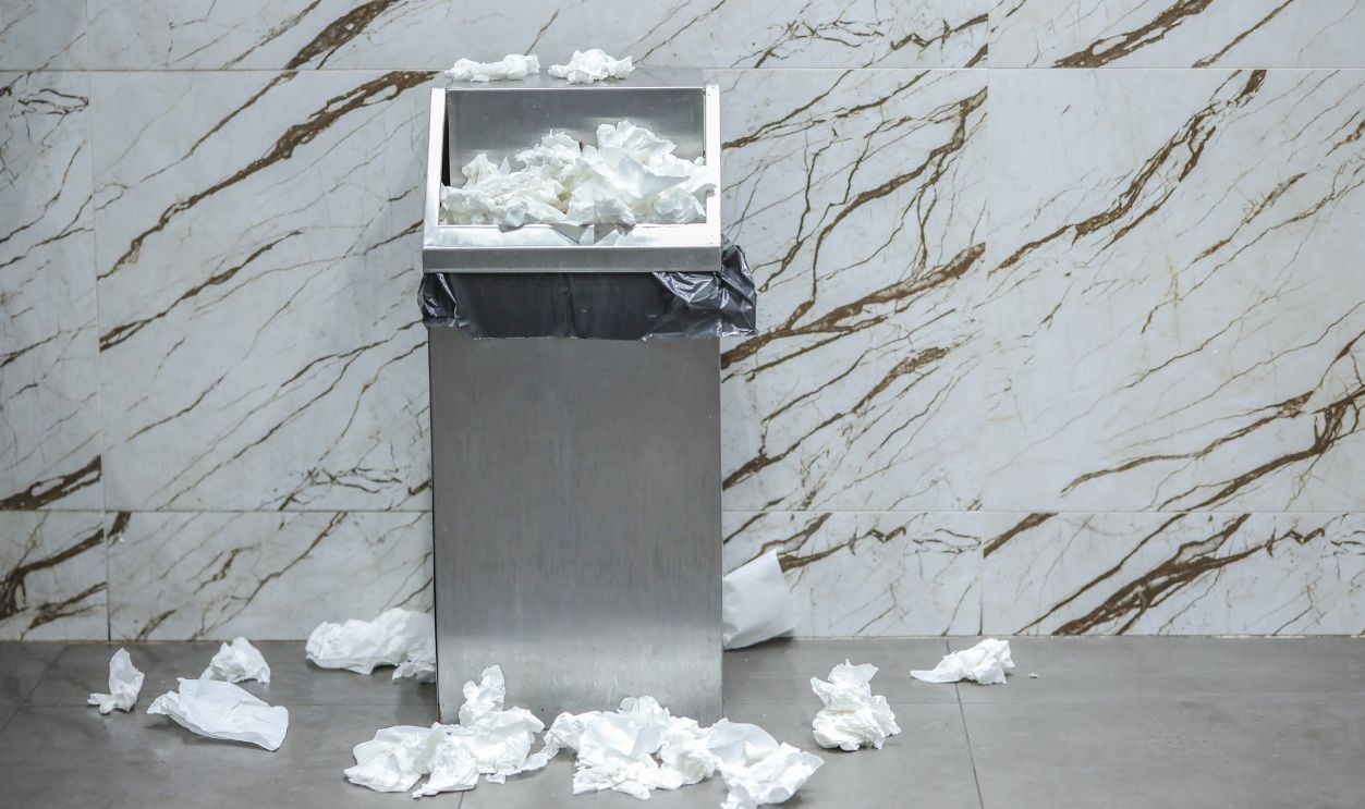 Throwing Paper Towels Near the Trash