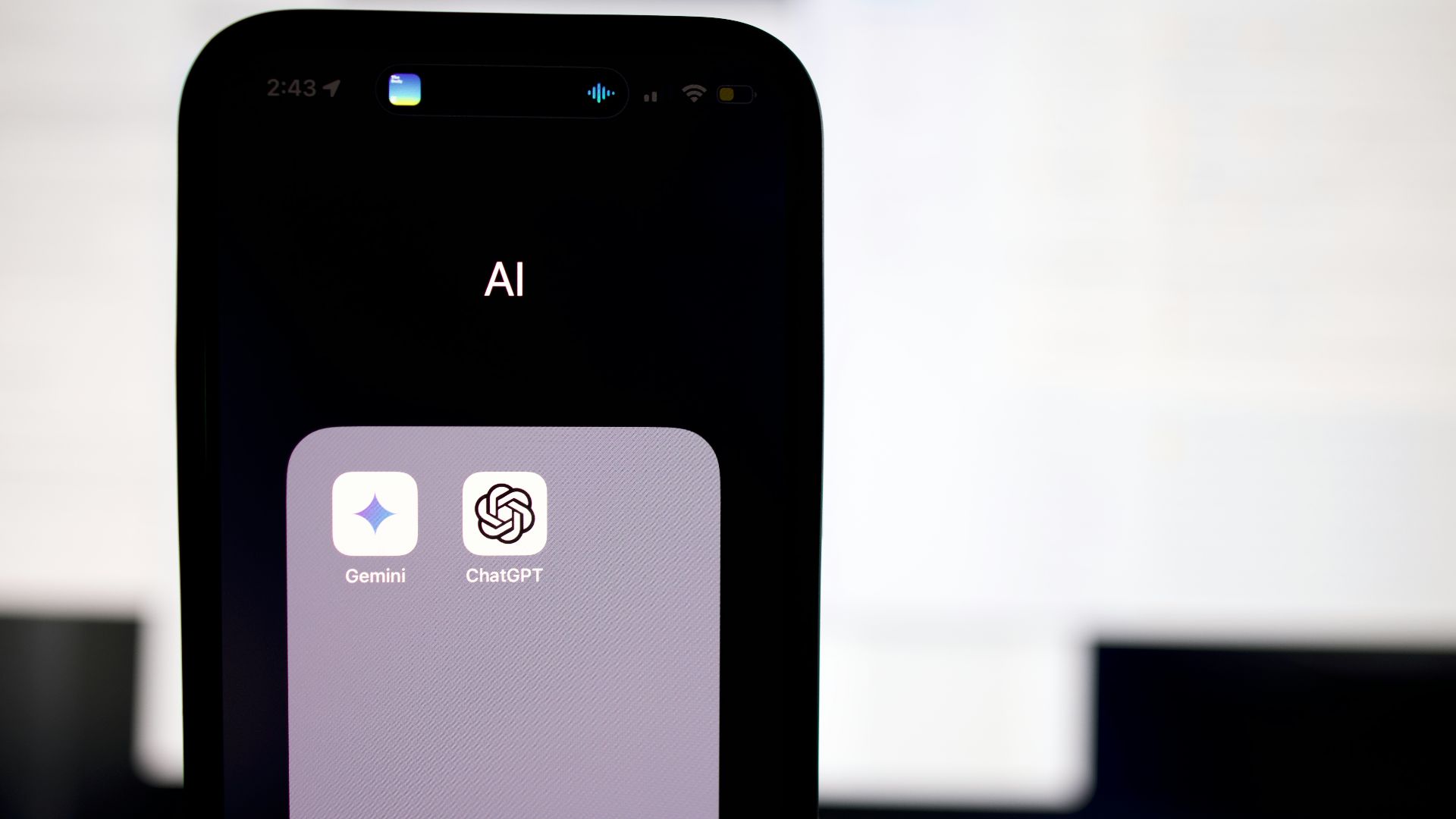 a close up of a cell phone with an ai button