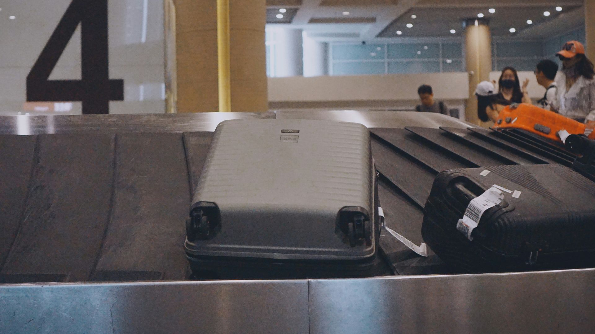A couple of suitcases sitting on top of a conveyor belt