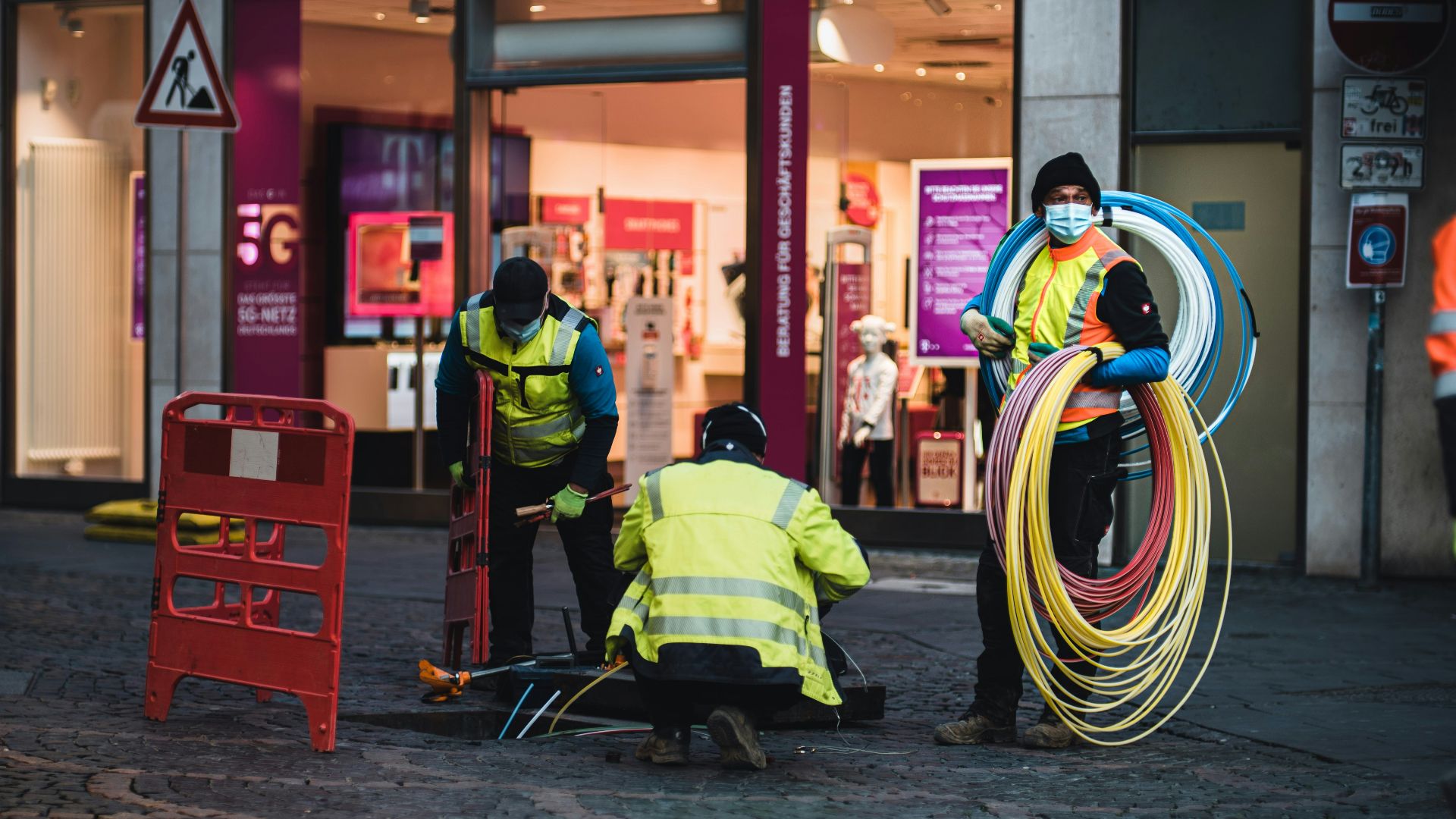 man in green jacket sitting on chair