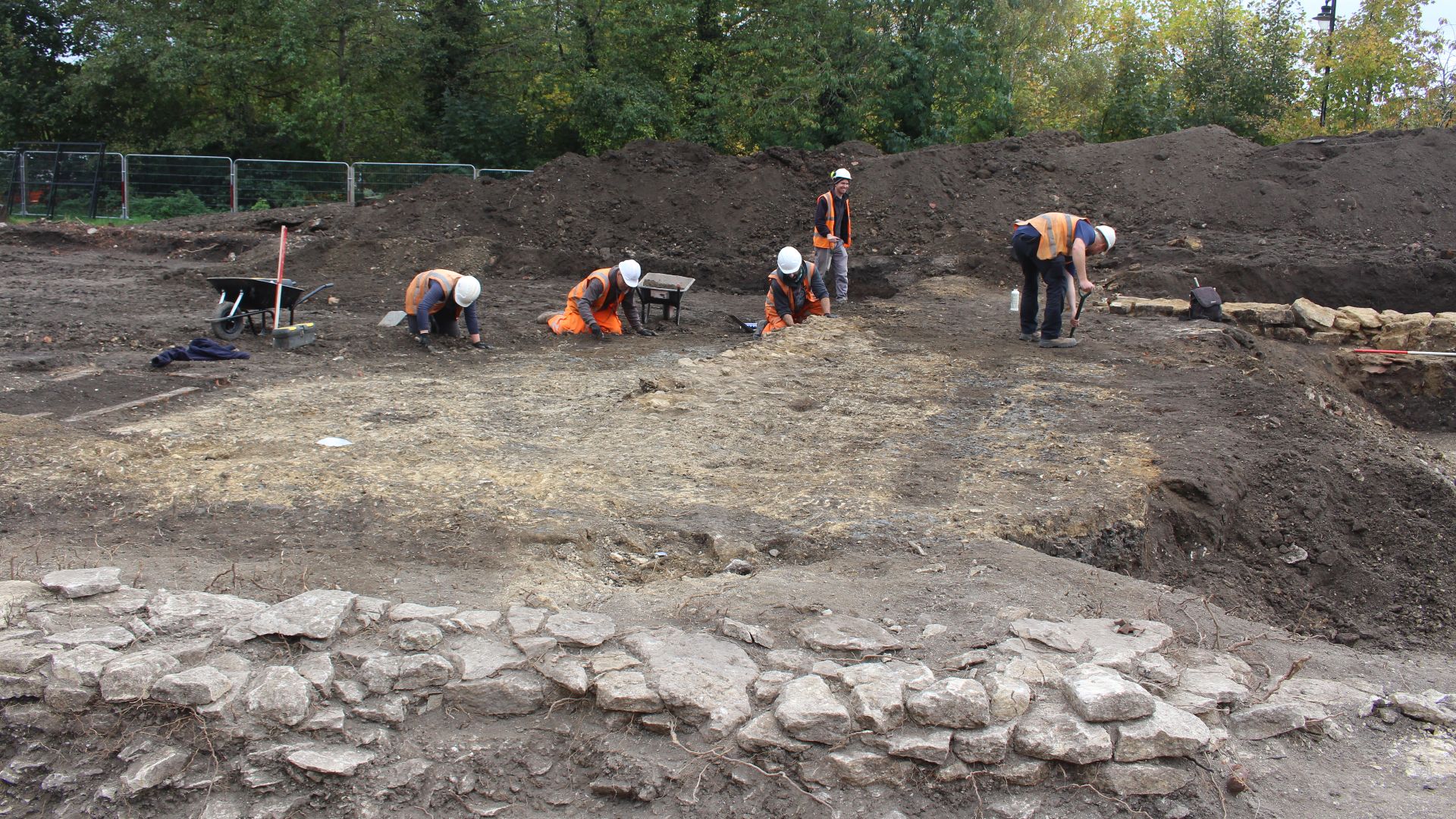 File:Archaeologists cleaning a surface at The Pippin, Calne 2021.jpg