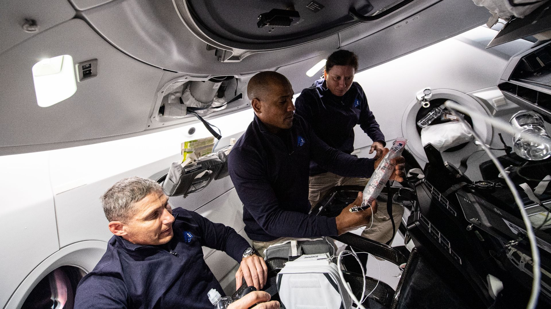File:NASA astronauts work aboard the SpaceX Crew Dragon (iss064e004754).jpg