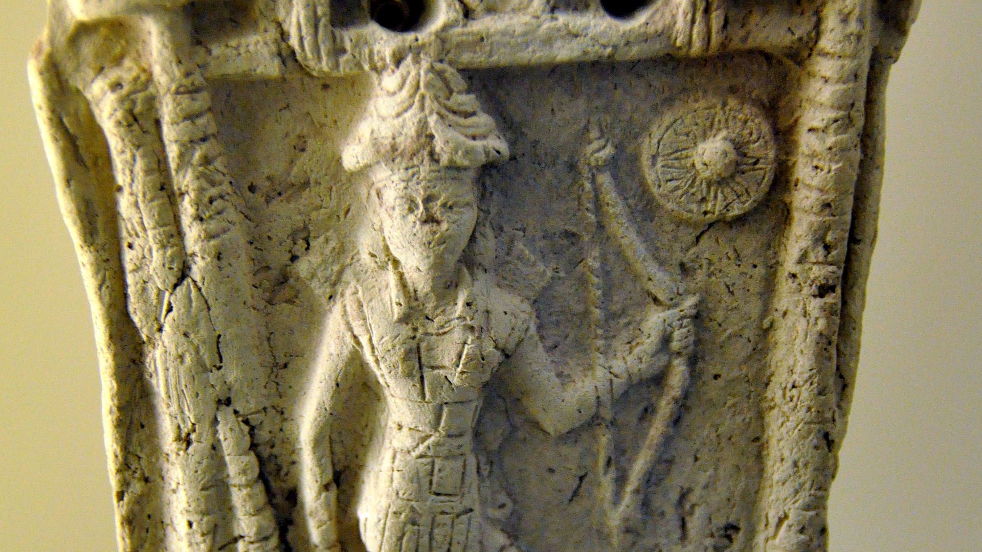 File:Goddess Ishtar stands on a lion and holds a bow, god Shamash symbol at the upper right corner, from Southern Mesopotamia, Iraq.jpg