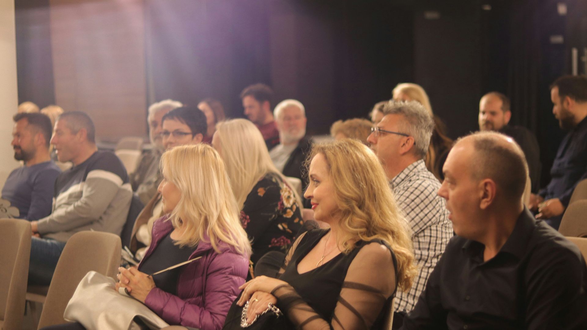 a group of people sitting in a room