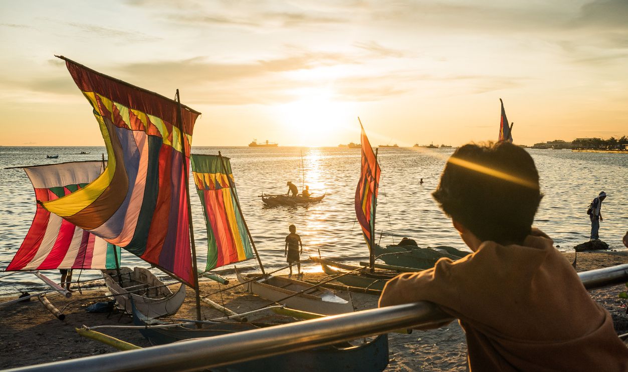 Gettyimages - 2190741836, Tourism in Southern Philippines ZAMBOANGA CITY, PHILIPPINES - OCTOBER 5, 2024: Colorful sails, called Vinta, of the Same Bajau line the shore of Zamboanga City during its weeks-long Hermosa Festival. The city is host to the headquarters of the Western Mindanao Command (WESMINCOM) of the Armed Forces of the Philippines (AFP). Zamboanga is recovering from the image created by the 'Zamboanga Siege' of 2014, when Moro rebels from the Moro National Liberation Front (MNLF) attempted to occupy several coastal communities in protest of government policies. Relative to its neighboring islands and regions, the city has been spared of much of the insurgency and banditry that has characterized Mindanao for decades.