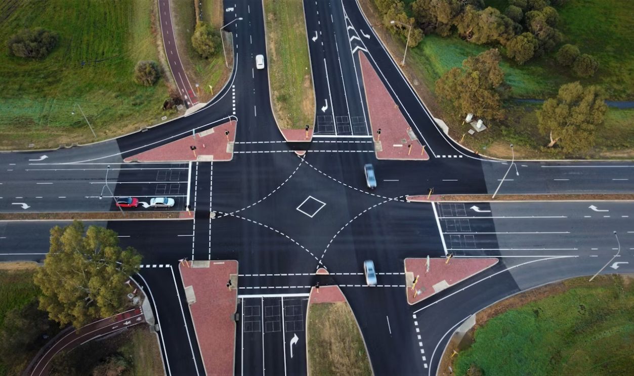 an aerial view of a street intersection in a city