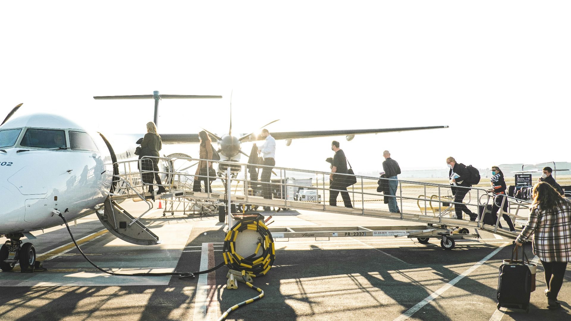 people boarding a plane