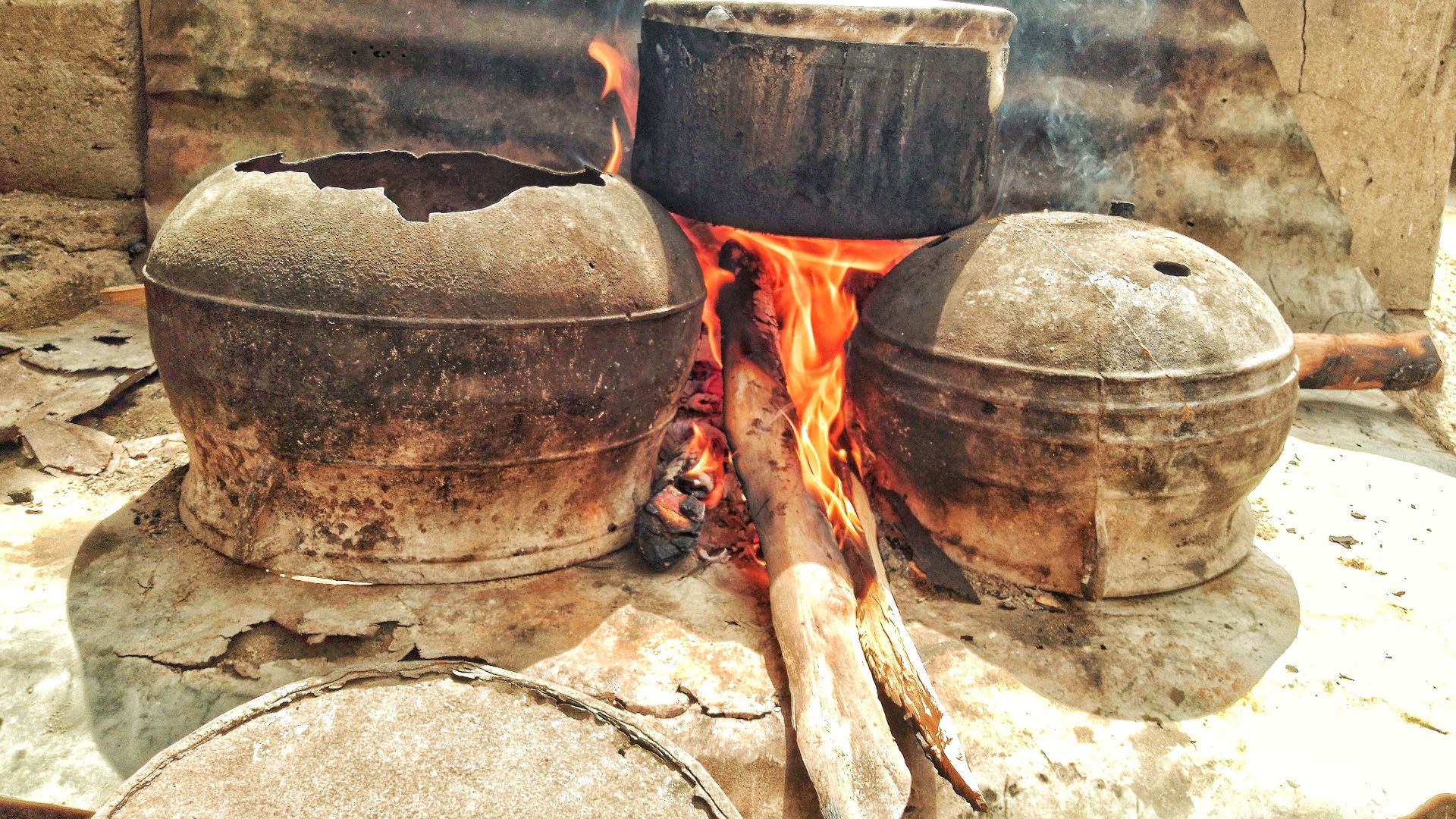 File:Traditional cooking method - food on local fire.jpg