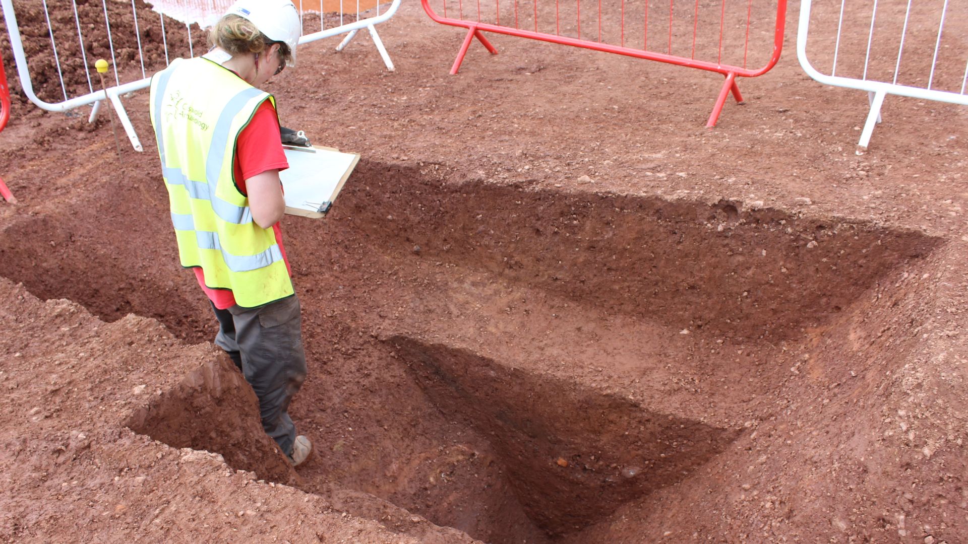 File:Archaeologist recording a ditch feature.jpg