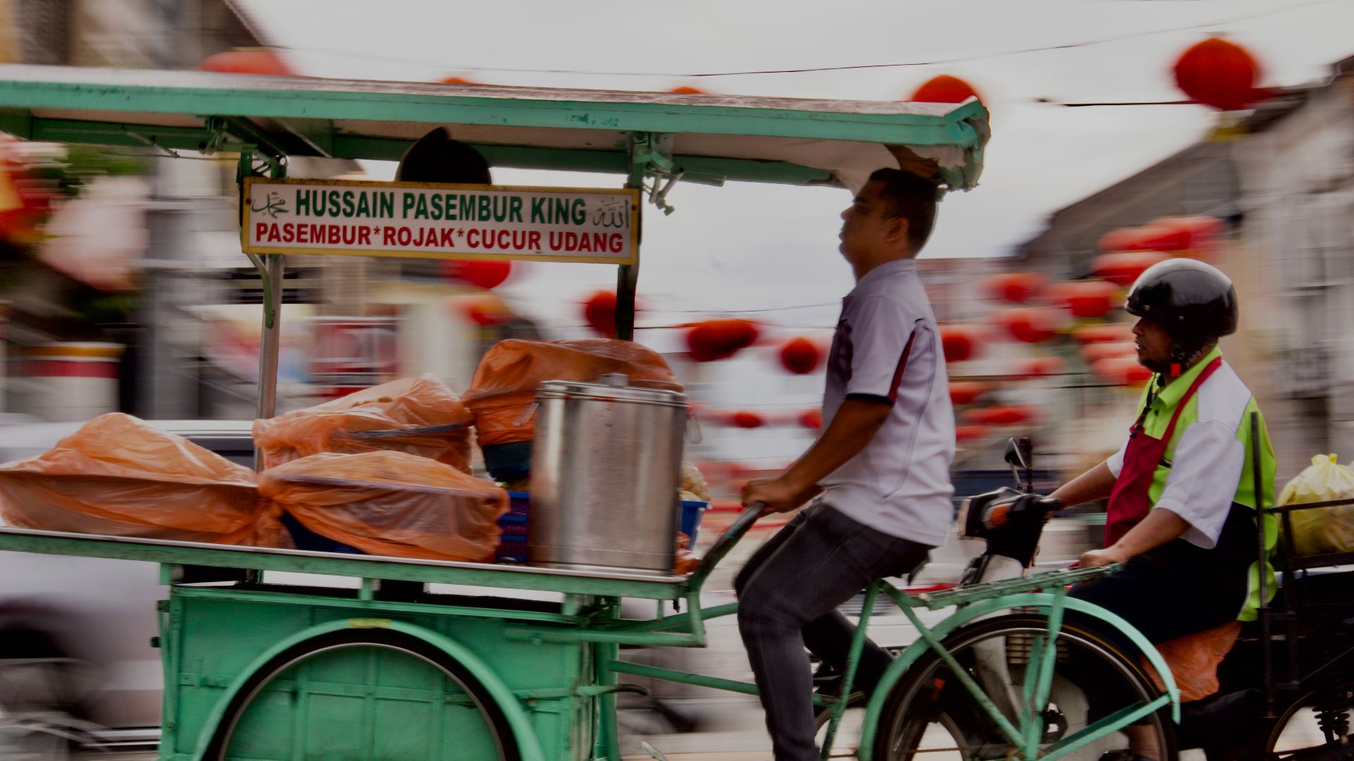 File:Riding Through Tradition – The Pasembur Vendor of Penang.jpg