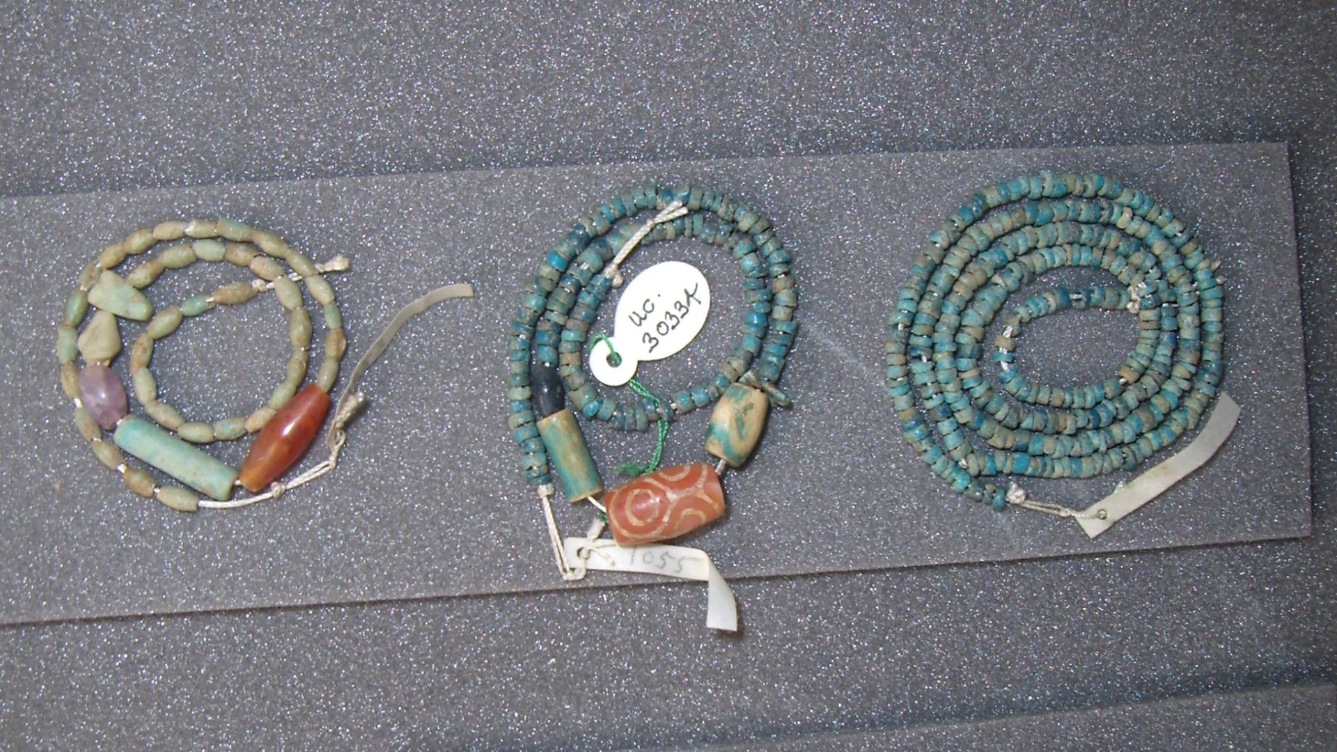 File:Various necklaces including necklace with etched Indus carnelian bead UC30334 Egypt Middle Kingdom London, Petrie Museum of Egyptian Archaeology.jpg