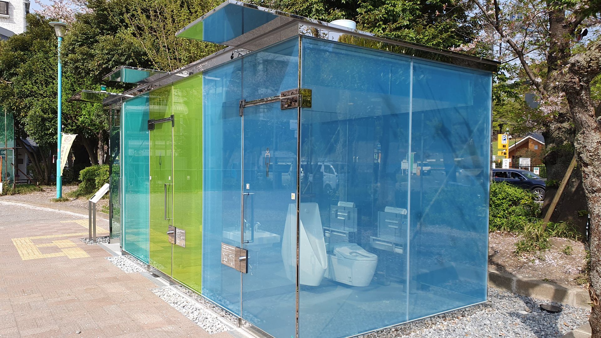 File:Transparent toilets at Harunogawa community park, locking the door makes the walls opaque 2.jpg
