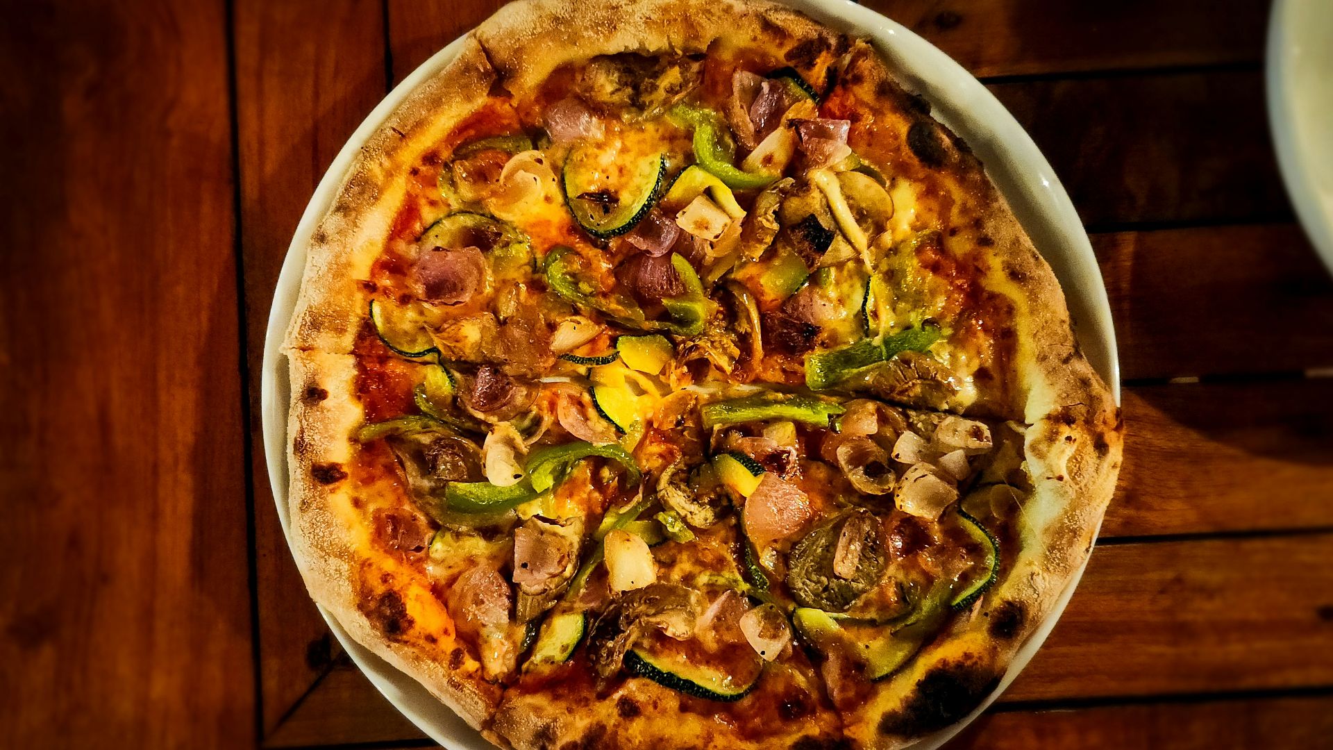 Here's a possible caption: a delicious, colorful pizza is ready to eat.