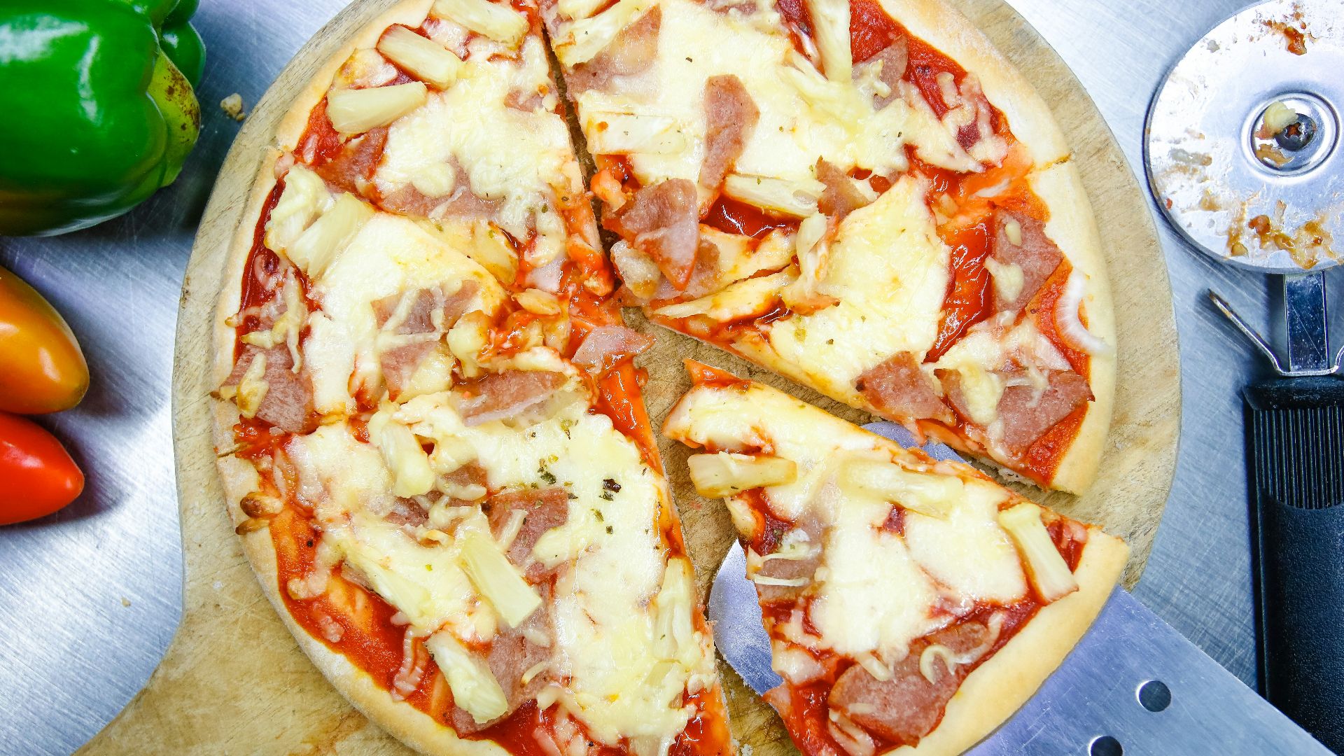 pizza on brown wooden round plate