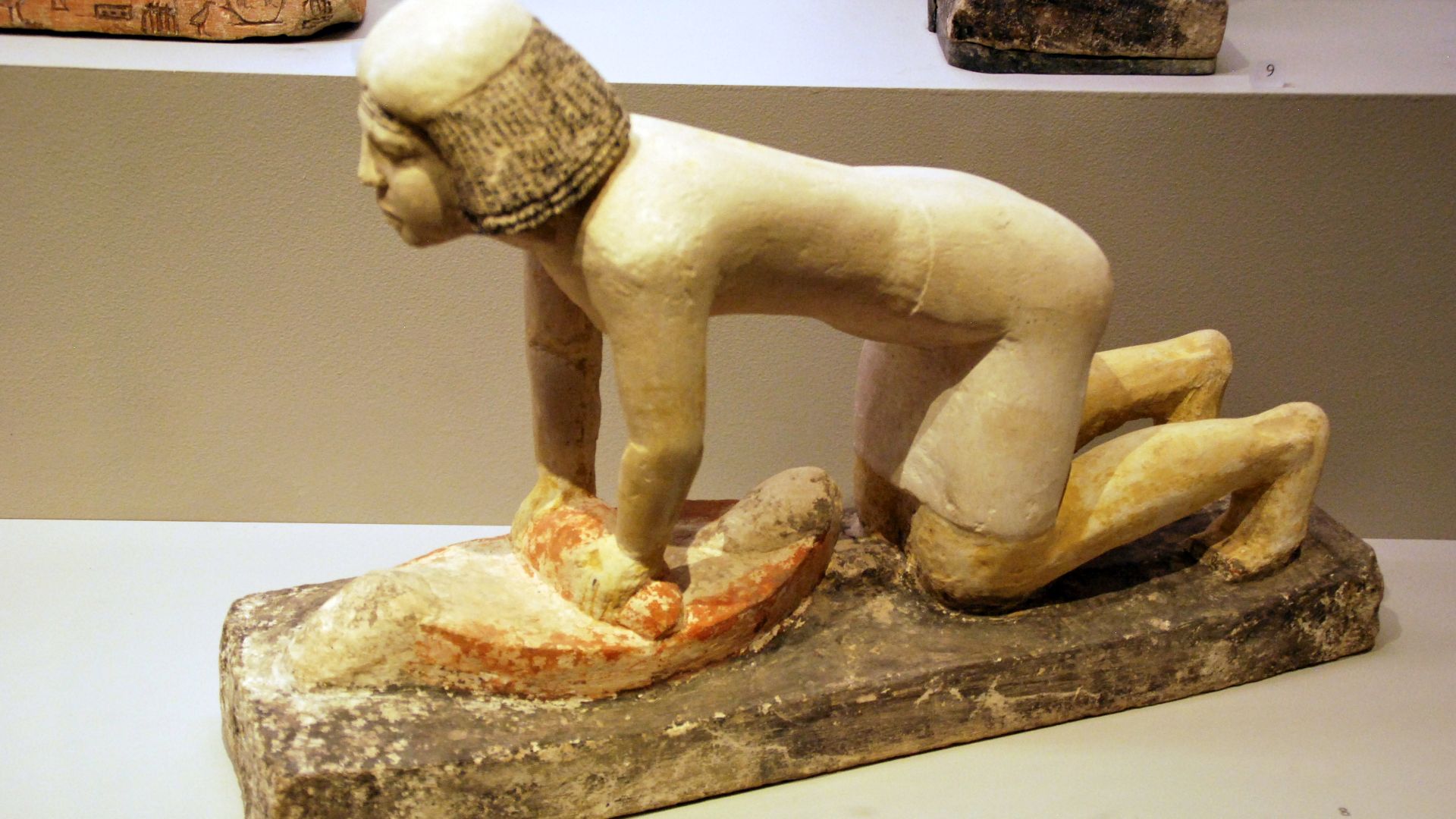 File:Ancient egyptian statuette of a woman grinding grain 1.jpg