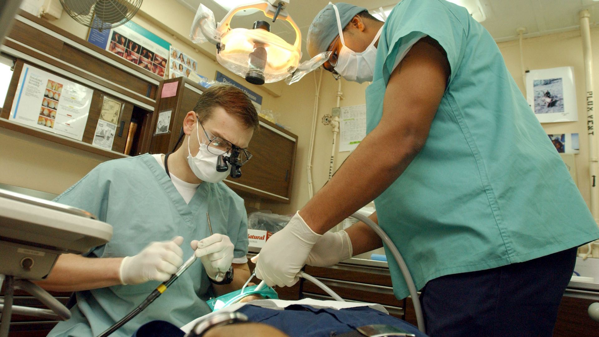 File:US Navy 030124-N-1328C-510 Navy dentist treats patients aboard ship.jpg